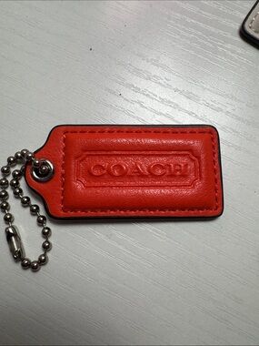 COACH Bright Orange/Red Leather Key Tag with Embossed Logo